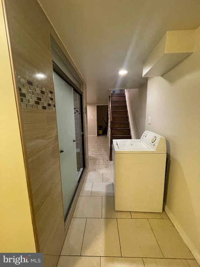 washroom featuring light tile patterned floors and washer / clothes dryer