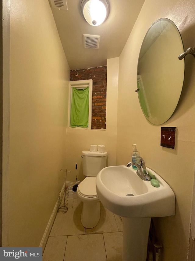 bathroom with tile patterned floors and toilet