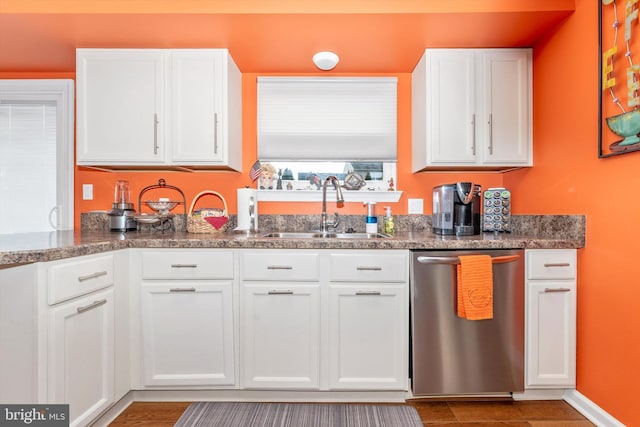 kitchen featuring sink, stainless steel dishwasher, and white cabinets