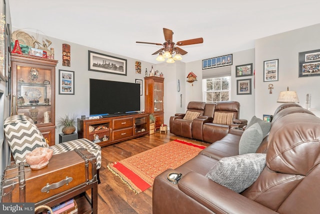 living room featuring ceiling fan and hardwood / wood-style floors