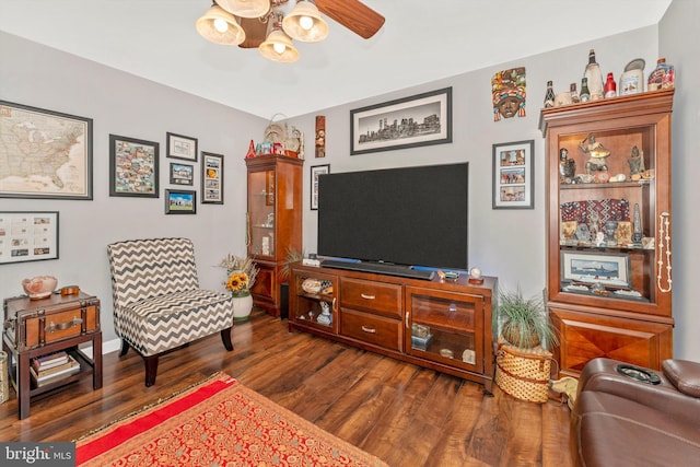 sitting room featuring dark hardwood / wood-style floors and ceiling fan