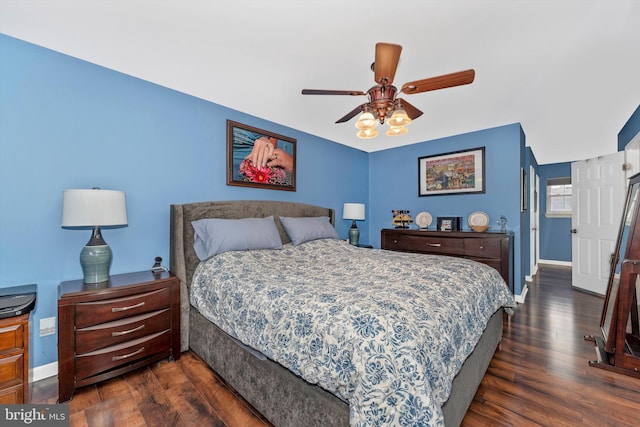 bedroom with dark wood-type flooring and ceiling fan