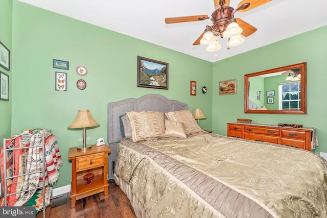 bedroom featuring dark hardwood / wood-style floors and ceiling fan