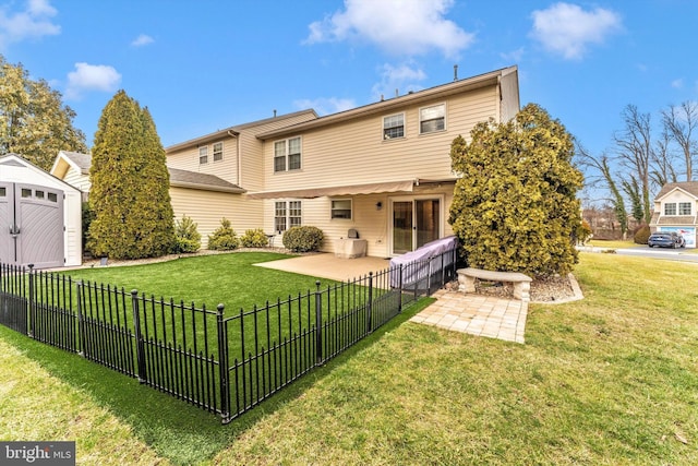 rear view of property with a patio and a lawn