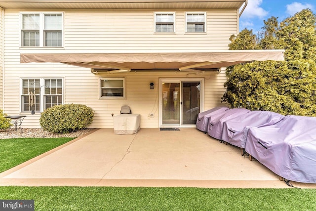 back of property with a patio area