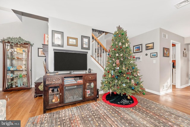 living room with light hardwood / wood-style flooring