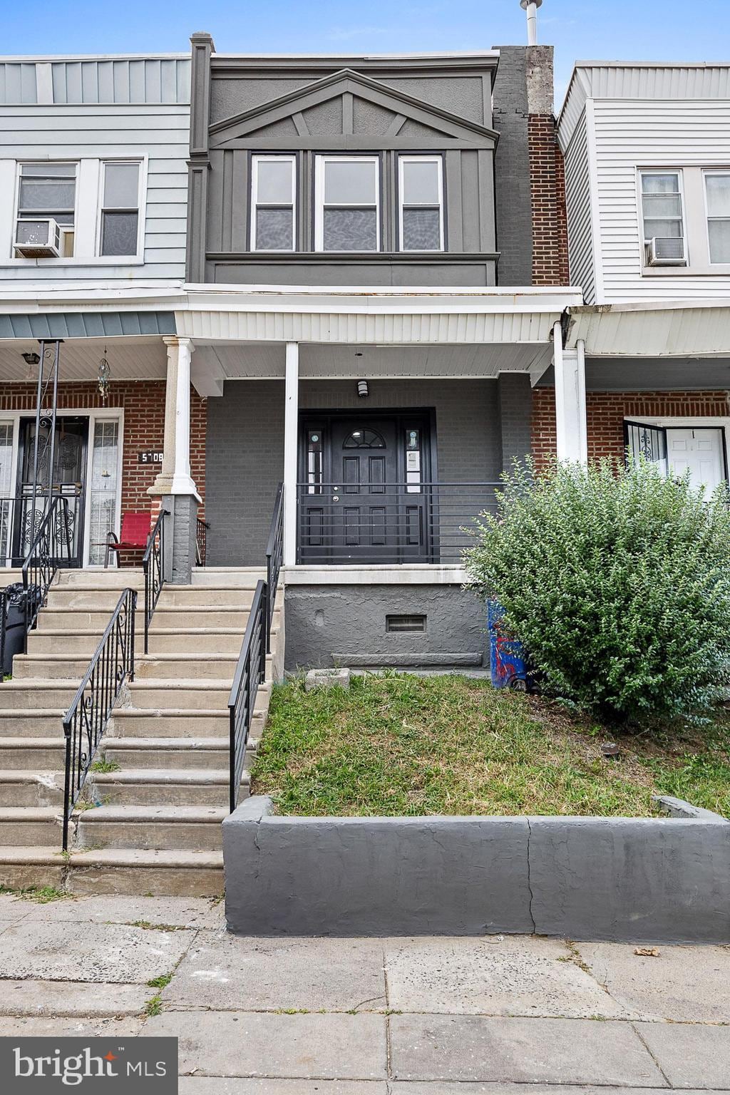 multi unit property featuring a porch