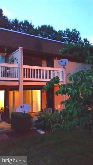 rear view of house with a balcony