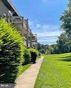 view of home's community featuring a lawn