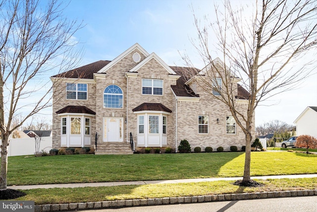 view of front of home with a front lawn