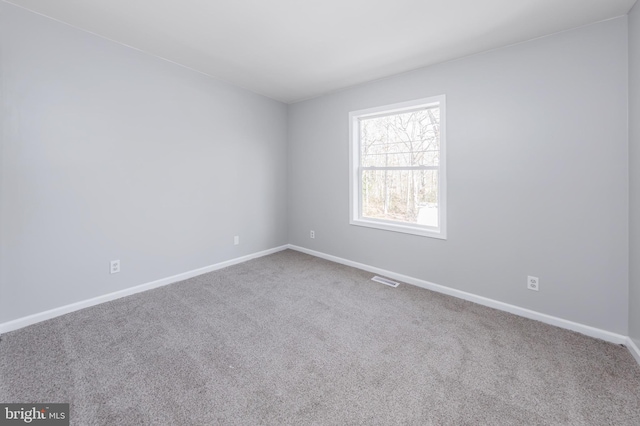 empty room featuring carpet flooring