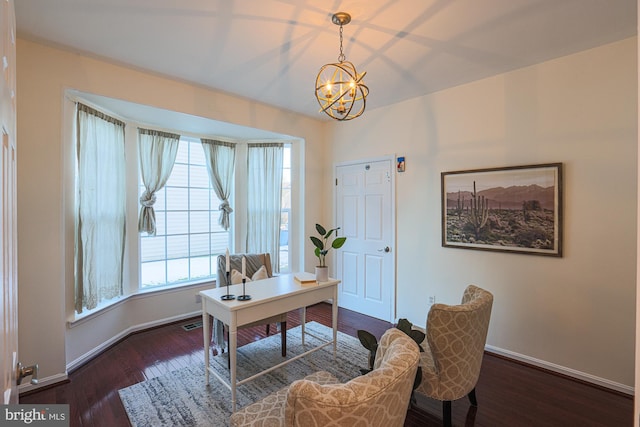 office area with dark hardwood / wood-style floors and a chandelier