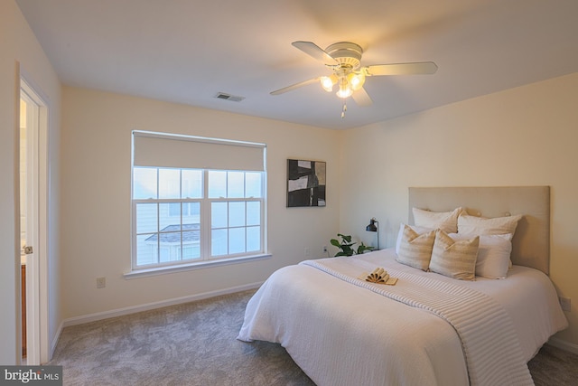 carpeted bedroom with ceiling fan