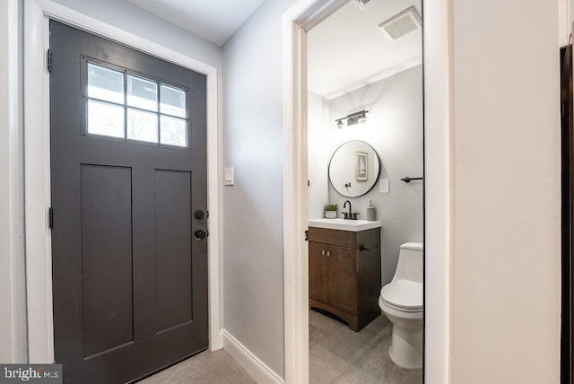 bathroom with vanity and toilet