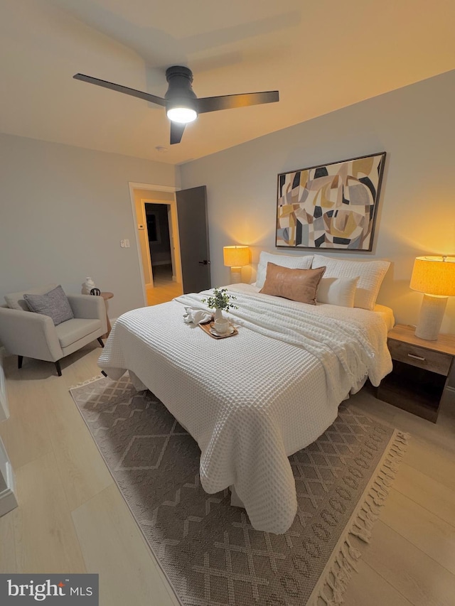 bedroom featuring ceiling fan and wood-type flooring