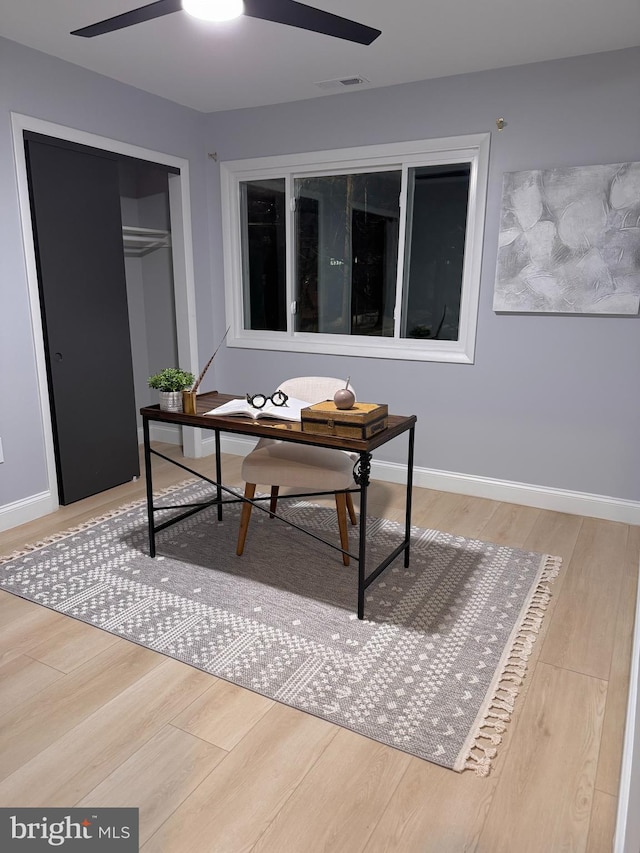 office area with hardwood / wood-style floors and ceiling fan