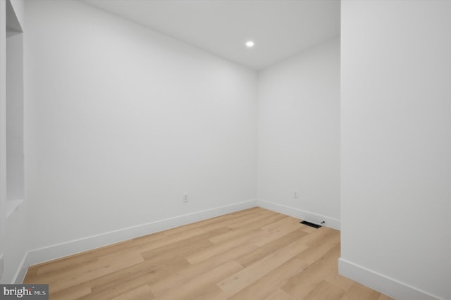 empty room featuring hardwood / wood-style flooring