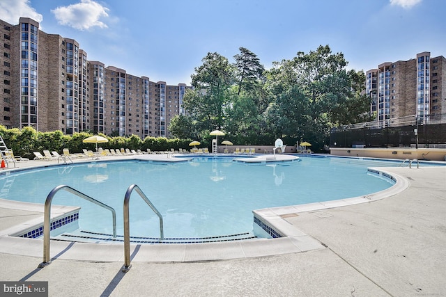 view of swimming pool with a patio area