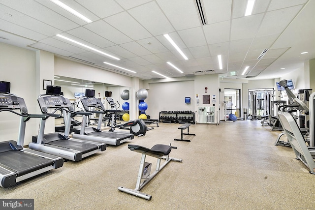 workout area with a drop ceiling