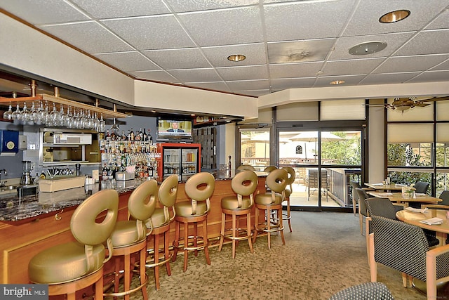 bar featuring a drop ceiling