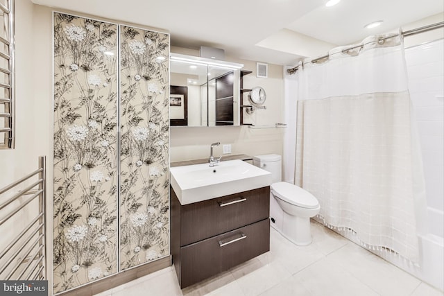 bathroom with tile patterned flooring, vanity, curtained shower, and toilet