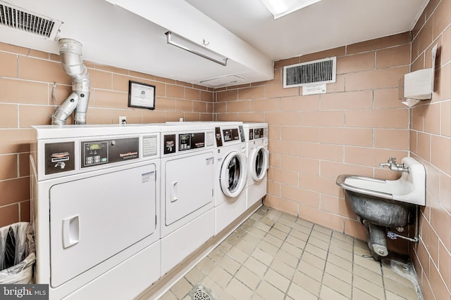 laundry room featuring washing machine and clothes dryer