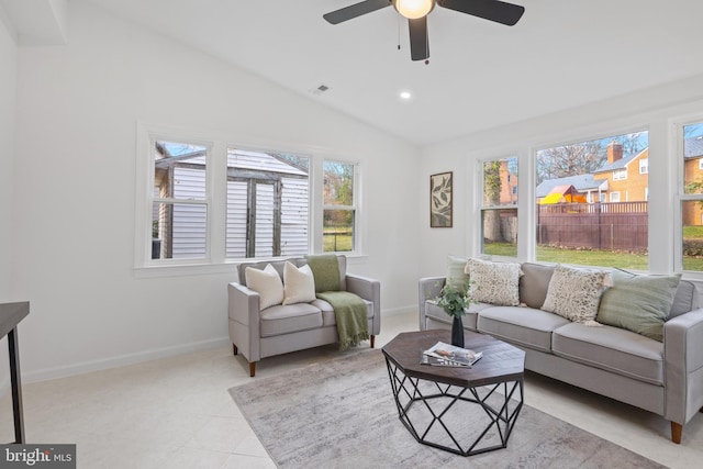 tiled living room with ceiling fan, a healthy amount of sunlight, and lofted ceiling