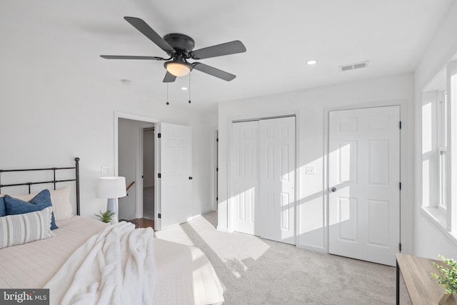 carpeted bedroom featuring ceiling fan