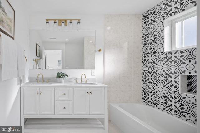 bathroom featuring vanity and tub / shower combination