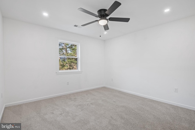 carpeted empty room with ceiling fan