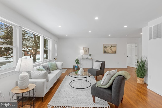 living room with light hardwood / wood-style floors