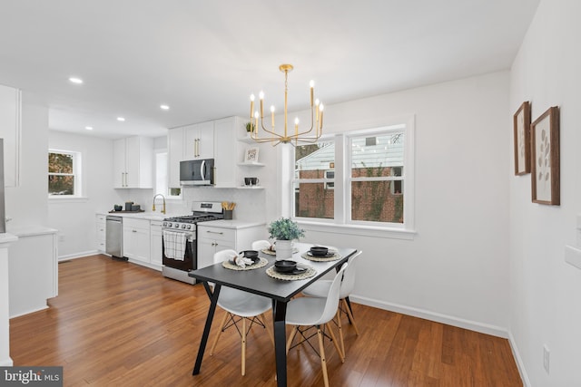 dining room featuring a notable chandelier and dark hardwood / wood-style floors