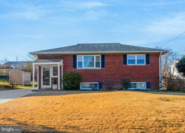 view of front of property with a sunroom and a front lawn