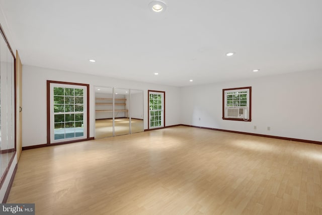 unfurnished living room featuring light wood-type flooring