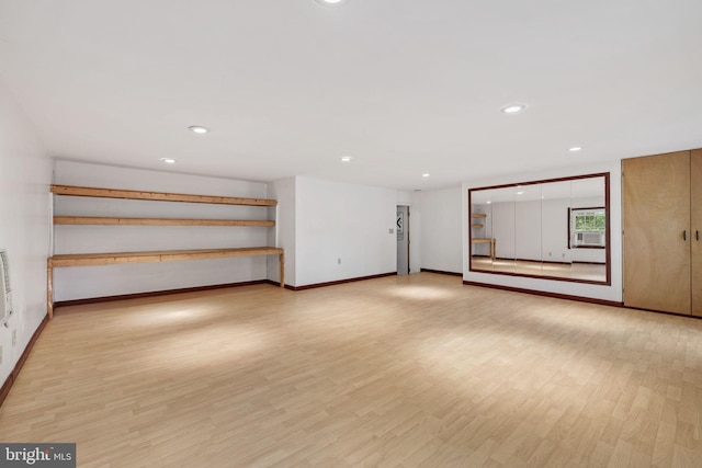 unfurnished living room featuring light wood-type flooring