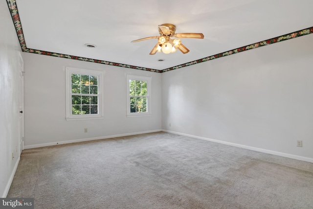 carpeted empty room with ceiling fan