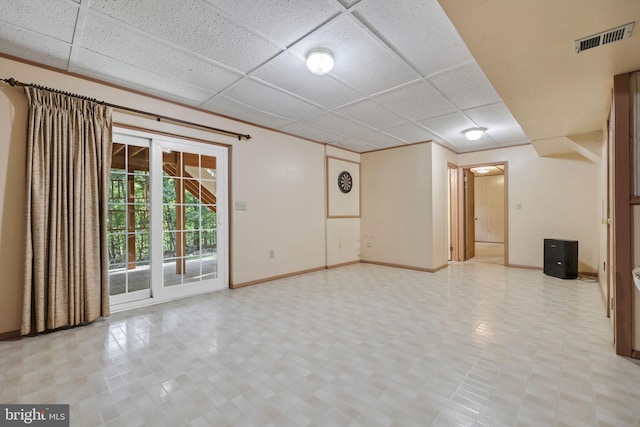 interior space featuring a drop ceiling