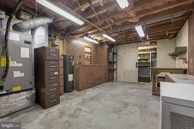 basement with a workshop area and electric water heater