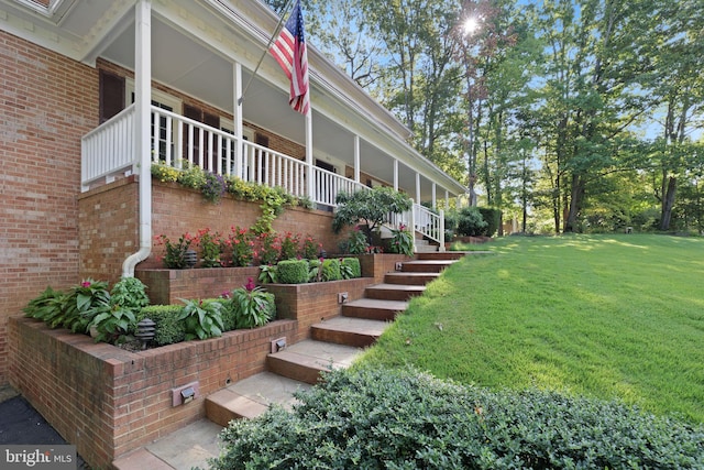 view of yard with covered porch