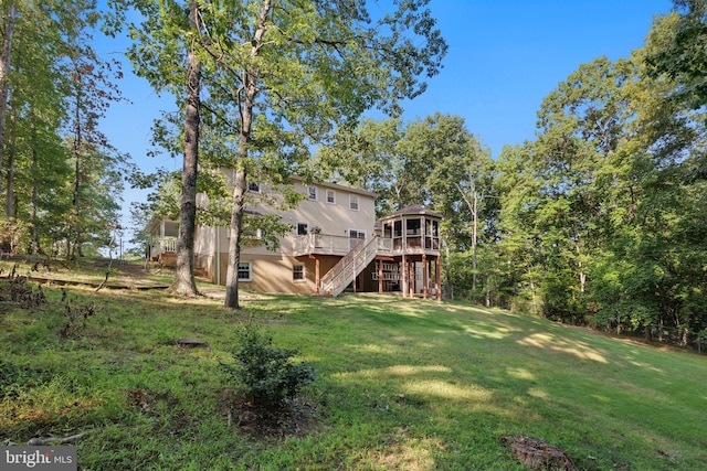 view of yard with a wooden deck