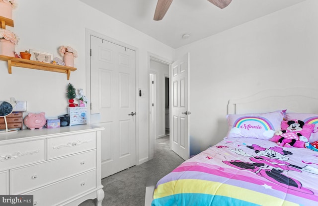 carpeted bedroom featuring ceiling fan