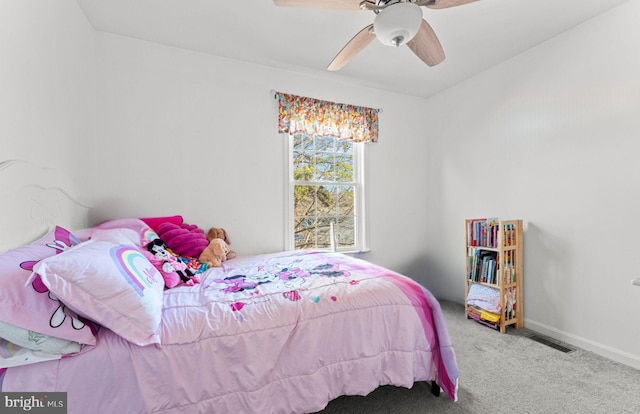 bedroom with ceiling fan and light carpet