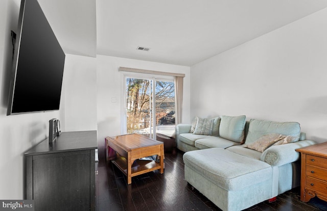 living room with dark hardwood / wood-style flooring