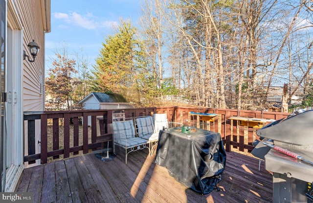 wooden deck with grilling area