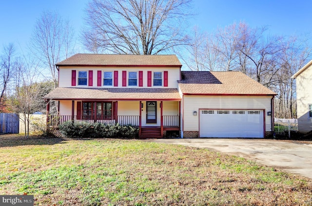 view of front of property featuring a front lawn, a porch, and a garage