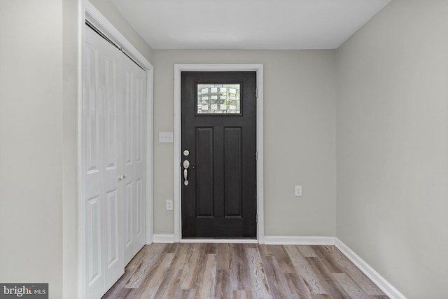 entryway with light hardwood / wood-style flooring