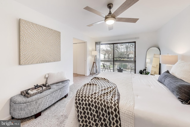 carpeted bedroom featuring access to exterior and ceiling fan