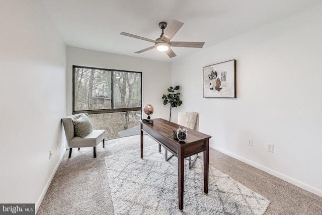 office featuring light carpet and ceiling fan