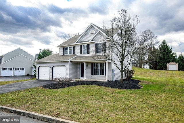 front of property with a garage and a front lawn