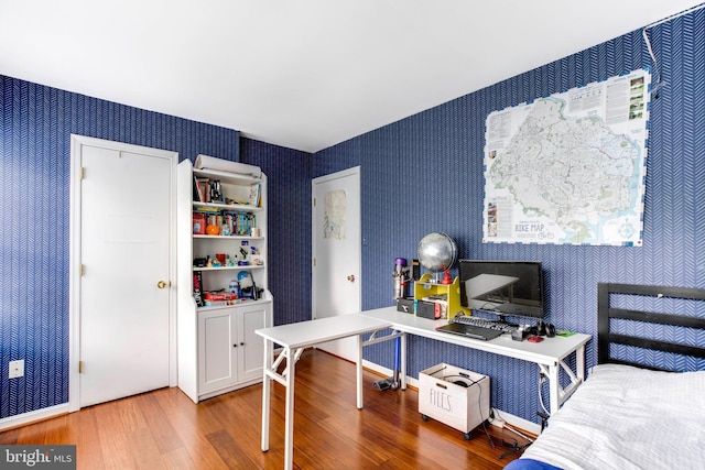 bedroom with hardwood / wood-style floors